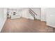 Open living space with hardwood floors and stairs at 115 Ciara Pl # A, Mooresville, NC 28117
