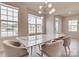 Spacious dining area with marble top table and light-filled windows at 13905 Castle Nook Dr, Charlotte, NC 28273