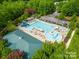 An aerial view of a community swimming pool and recreation area at 18023 Train Station Dr, Cornelius, NC 28031