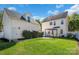 Spacious backyard with lush green grass, a pergola, and a storage shed at 18023 Train Station Dr, Cornelius, NC 28031