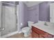 Compact bathroom with a glass-enclosed shower, toilet, and vanity with a sink at 18023 Train Station Dr, Cornelius, NC 28031