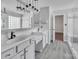Modern bathroom featuring double vanity, glass shower, and modern fixtures at 18023 Train Station Dr, Cornelius, NC 28031