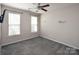 Bedroom with neutral carpet, natural light, and neutral walls at 18023 Train Station Dr, Cornelius, NC 28031