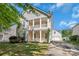 Charming two-story home with a lush green front yard and a driveway at 18023 Train Station Dr, Cornelius, NC 28031