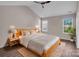 Bright and airy main bedroom with vaulted ceiling, ceiling fan, and wood-look floors at 18023 Train Station Dr, Cornelius, NC 28031