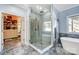 Beautiful bathroom with modern shower, soaking tub, and walk-in closet access at 20361 Enclave Oaks Ct, Cornelius, NC 28031