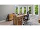 Bright home office with bay window, wood desk, and plush carpet at 20361 Enclave Oaks Ct, Cornelius, NC 28031