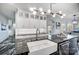 Bright kitchen with white cabinetry, marble countertops, and stainless steel appliances at 20361 Enclave Oaks Ct, Cornelius, NC 28031