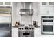 Kitchen featuring stainless steel appliances, modern cabinetry, and a designer backsplash at 20361 Enclave Oaks Ct, Cornelius, NC 28031