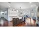 Open kitchen area featuring a large island, farmhouse sink, and sleek cabinetry, perfect for culinary creations and gatherings at 20361 Enclave Oaks Ct, Cornelius, NC 28031