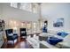 Spacious living room featuring a high ceiling, large windows, and elegant furnishings at 20361 Enclave Oaks Ct, Cornelius, NC 28031