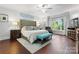 Inviting bedroom with a large bed, wood floors, and ample natural light at 20361 Enclave Oaks Ct, Cornelius, NC 28031