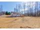 Expansive backyard with a newly built home, featuring a lush lawn and a deck at 1162 Scenic Cir, Shelby, NC 28150