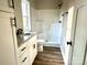 Clean bathroom featuring a shower/tub combo, granite vanity, and vinyl flooring at 1162 Scenic Cir, Shelby, NC 28150