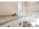 Bathroom featuring granite countertops, white cabinets, and a shower-tub combination at 1162 Scenic Cir, Shelby, NC 28150