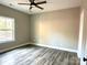 Spacious bedroom with wood-look floors and a large window at 1162 Scenic Cir, Shelby, NC 28150