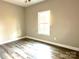 Spacious bedroom with wood-look floors and a large window at 1162 Scenic Cir, Shelby, NC 28150