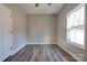 Empty bedroom with natural light, fresh paint, vinyl floors, and a neutral color palette at 1162 Scenic Cir, Shelby, NC 28150