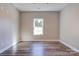 Empty bedroom with natural light, fresh paint, neutral color palette, and vinyl floors at 1162 Scenic Cir, Shelby, NC 28150