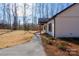 Side view of a stylish one-story home showcasing its well-kept yard and charming details at 1162 Scenic Cir, Shelby, NC 28150