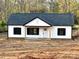 Newly constructed home featuring a white exterior, black shutters, and gray roof at 1162 Scenic Cir, Shelby, NC 28150