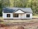 Newly constructed home featuring a white exterior, black shutters, and gray roof at 1162 Scenic Cir, Shelby, NC 28150