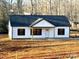 Newly constructed home with white siding, black shutters, and a gray roof at 1162 Scenic Cir, Shelby, NC 28150