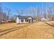 Stylish one-story home showcasing black shutters with a well-manicured lawn on a sunny day at 1162 Scenic Cir, Shelby, NC 28150