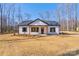 Charming one-story home with black shutters, wood porch supports and a well-manicured lawn at 1162 Scenic Cir, Shelby, NC 28150