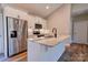 Well-lit kitchen with stainless steel appliances, white cabinets, and a center island at 1162 Scenic Cir, Shelby, NC 28150