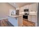 Well-lit kitchen with stainless steel appliances, white cabinets, and a center island at 1162 Scenic Cir, Shelby, NC 28150