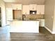 Modern kitchen with white cabinets, granite countertops, and island at 1162 Scenic Cir, Shelby, NC 28150