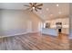 Open-concept living room with vaulted ceilings and modern kitchen featuring stainless appliances at 1162 Scenic Cir, Shelby, NC 28150