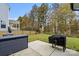 A cozy backyard featuring a patio and grill, perfect for outdoor entertaining and relaxation at 122 W Heart Pine Ln, Statesville, NC 28677