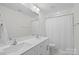 Bright bathroom featuring double vanity sinks and a shower-tub combination at 122 W Heart Pine Ln, Statesville, NC 28677