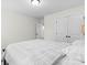 Inviting bedroom featuring soft natural light, closet space and calm neutral paint color at 122 W Heart Pine Ln, Statesville, NC 28677