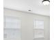 Bright room featuring windows with white blinds, allowing for natural light at 122 W Heart Pine Ln, Statesville, NC 28677