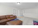 Spacious bonus room features neutral walls, plush carpeting, and ample space for relaxation at 122 W Heart Pine Ln, Statesville, NC 28677