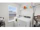 Well-lit laundry room with modern washer and dryer, offering convenience and efficiency at 122 W Heart Pine Ln, Statesville, NC 28677