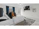Bedroom featuring tufted headboard, plush carpet, and a hidden drop-down TV at 122 W Heart Pine Ln, Statesville, NC 28677