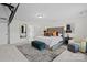 Bright and luxurious main bedroom with tufted headboard, large windows, and ensuite bathroom at 122 W Heart Pine Ln, Statesville, NC 28677