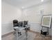 Bright home office with modern desk, comfortable chair, and natural light at 122 W Heart Pine Ln, Statesville, NC 28677
