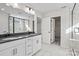 Bright bathroom boasts double sinks, sleek cabinets, modern fixtures, and an elegant marble shower at 13720 Roderick Dr # 167, Huntersville, NC 28078