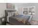 Spacious bedroom with large window and plush bedding at 278 Harpers Run Ln, Matthews, NC 28104