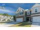 Two-story townhome with attached garage and well-manicured lawn at 278 Harpers Run Ln, Matthews, NC 28104