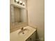 Small bathroom with vanity, sink, and decorative mirror at 3312 Heathstead Pl, Charlotte, NC 28210