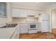 Cozy kitchen with white cabinets and modern appliances at 3312 Heathstead Pl, Charlotte, NC 28210