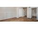 Living Room with wood floors, white trim, and closet at 3312 Heathstead Pl, Charlotte, NC 28210