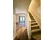 Staircase leading to upper level, hardwood floors throughout at 3312 Heathstead Pl, Charlotte, NC 28210