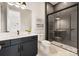 Modern bathroom with walk-in shower and dark vanity at 1325 Ballard Dr, Waxhaw, NC 28173